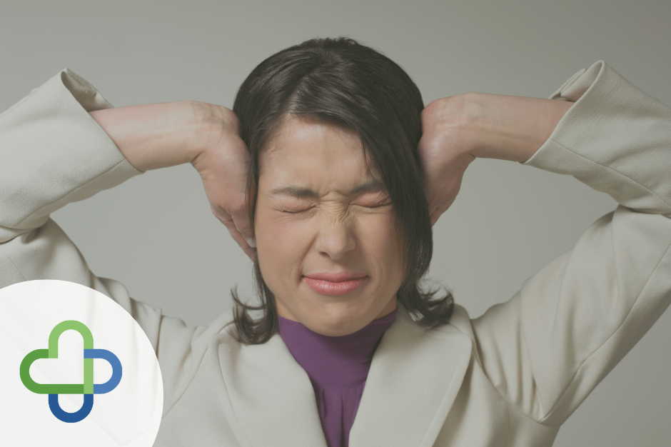 feature pic of woman holding ears